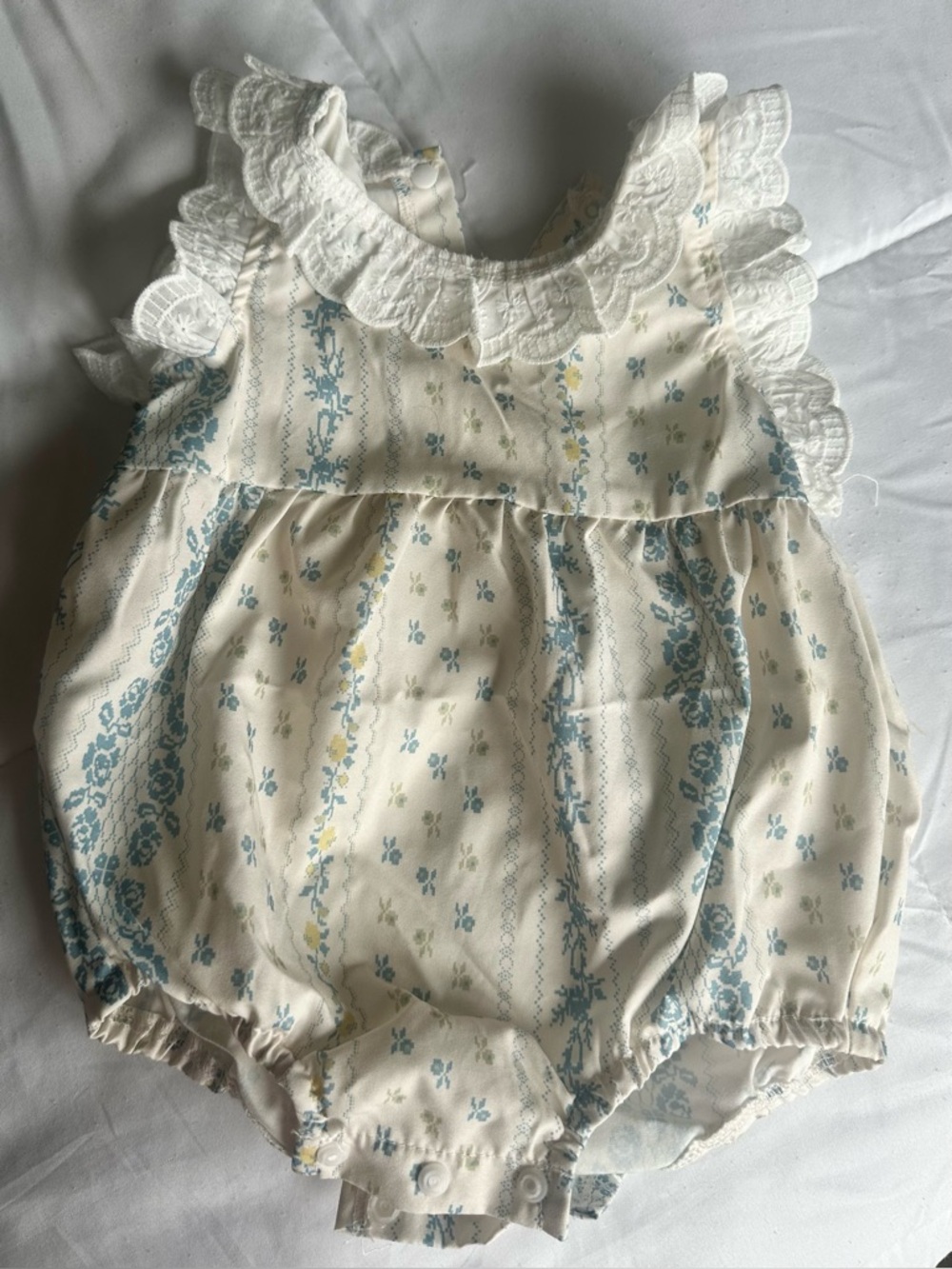 Vintage-Inspired Baby Romper with Blue Floral Print